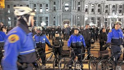 Joseph Police officers surround the Occupy Philly encampment Wednesday at Dilworth Plaza in Philadelphia. Police began pulling down tents early Wednesday after telling demonstrators they had to leave.