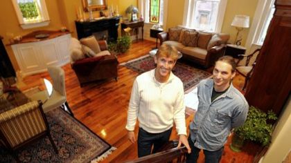 David McAnallen with contractor Eddie Pinto in the home's living room.
