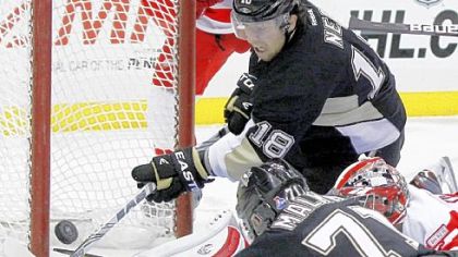 Despite an apparent open net left by a pileup, Red Wings goalie Jimmy Howard still made the save Tuesday against James Neal and Evgeni Malkin.