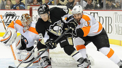 Penguins' Joe Vitale is stopped by the Flyers Marc-Andre Bourdon.
