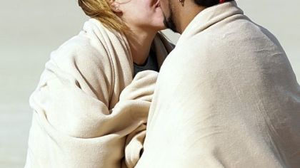 "Biggest Loser" contestants Jessica Limpert of Murrysville smooches with boyfriend Ramon Medeiros after running a marathon on last week's episode. Season finale is Tuesday.