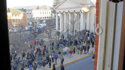 News crews linger on the lawn of the Centre County Courthouse after Jerry Sandusky waived his preliminary hearing.