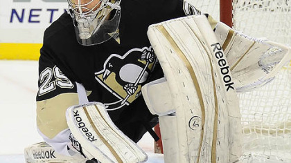 Marc-Andre Fleury reaches for his stick after making a save against the Sabres.