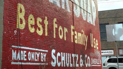 This sign has been on the side of a building on Penn Ave., east of N. Winebiddle for years. It appears to have been touched up as part of rejunvenation of the vacant lot.