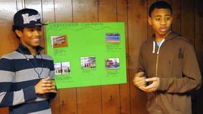 Anthony Thompson, left, 16, and Naekwon Wright, 15, present their community project for the Junior Green Corps of Operation Better Block in Homewood.