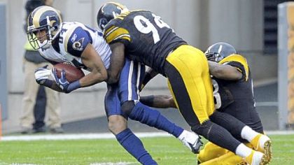 Lawrence Timmons and Jason Worilds take down St. Louis' Danario Alexander in the first quarter. Timmons had a big day with 10 tackles, a sack and two quarterback hurries.