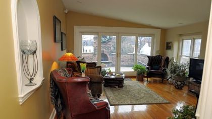 An upstairs casual room that was added on.