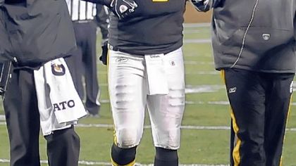 Ben Roethlisberger is helped off the field after getting injured against the Browns in the second quarter Thursday