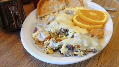 A super hoppel poppel at Benji's in Milwaukee includes potatoes, eggs, onions, fried salami, green peppers and mushrooms, all blanketed by melted Swiss cheese.