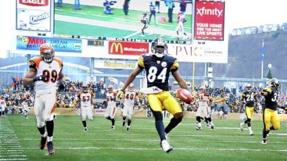 Antonio Brown celebrates in the end zone after scoring on a 60-yard punt return against the Bengals in the second quarter Sunday at Heinz Field.