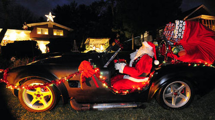 Santa rides in in a 1965 Shelby Cobra kit car made by Carol Vincini's son, Mike Palmer, an artist and mechanical engineer.