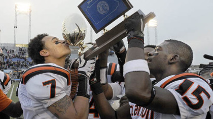 Clairton's Dakota Halcomb kisses the trophy after defeating Southern Columbia.
