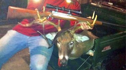 Outdoors and out of uniform, Steeler Brett Keisel shows off his eight-point and the sporting arm that downed it.