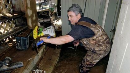 The sump and the pump must be clean and in good working order to be effective. Steve Coyle of Yardley, Pa., is shown cleaning his sump pump after water entered his basement on Sept. 20, 2004, when the remnants of Hurricane Ivan caused major flooding in Eastern Pennsylvania.