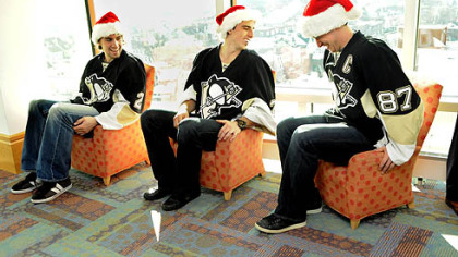 Penguins captain Sidney Crosby pulls himself out of a child-sized chair while he, Matt Niskanen and Marc-Andre Fleury wait to visit patients at Children's Hopsital of Pittsburgh of UPMC in Lawrenceville.