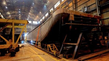 Final welding is done before a barge is moved outside for the last steps in construction and painting at  Brownsville Marine Products in Brownsville.