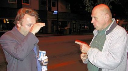 Christopher Hitchens (left) and Bob Hoover have an animated discussion on Oct. 5, 2004, Downtown after Mr. Hitchens' friend's plans to disrupt a presentation by former Secretary of State Henry Kissinger in Heinz Hall failed.