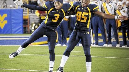 Stedman Bailey, left, Willie Milhouse and West Virginia are headed to the Orange Bowl as the Big East's BCS bid.