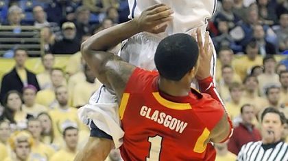 John Johnson drives to the basket against VMI's Rodney Glasgow in the first half of Pitt's blowout win Tuesday night at Petersen Events Center. Johnson came off the bench to score 13 points.