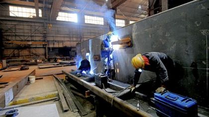Welding is done on one of the ends of a coal barge at Brownsville Marine Products in Brownsville.