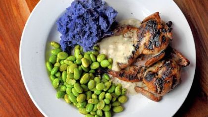 Grilled quail with Peruvian blue mashed potatoes, basque chili edamame and a house sausage.