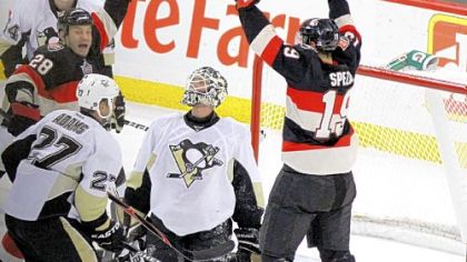 Penguins goaltender Brent Johnson looks up as the Senators' Jason Spezza (19) and Zenon Knopka (28) celebrate Knopka's goal in the second-period Friday in Ottawa, Ontario.