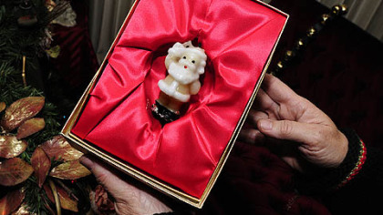 Carol Vicini's love for Christmas and Santa Claus began with this little candle, which was lit on her first birthday cake. She lit it again for her 60th birthday last year.