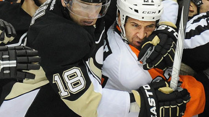 Penguins left winger James Neal wraps up former Penguins and current Flyers center Max Talbot on Thursday at Consol Energy Center.