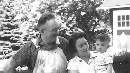 Maurice "Red O'Donnell, with his wife, Margaret Mary.  Mrs. O'Donnell is holding the couple's great-nephew, Gregory Hauck.