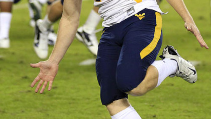 West Virginia kicker Tyler Bitancurt (40) reacts after kicking the game-winning field goal as time expires against South Florida last night in Tampa.