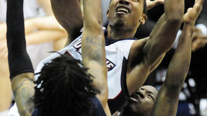 Dukes' B.J. Monteiro goes up for two points against  RMU.