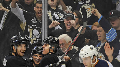 Evgeni Malkin, third from left, celebrates his third goal of the game against the Sabres Saturday night at Consol Energy Center.