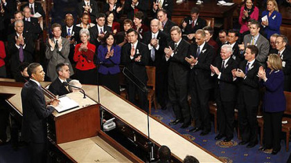 President Barack Obama is applauded on Capitol Hill in Washington prior to delivering his State of the Union address.