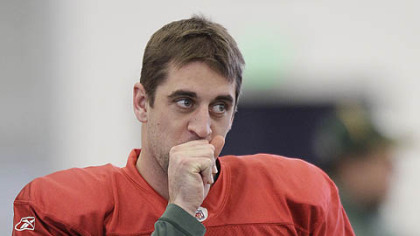 Packers quarterback Aaron Rodgers warms his hand during practice, Wednesday in Dallas.