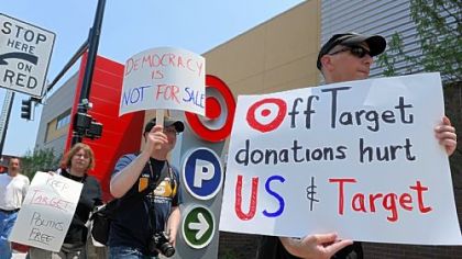 Bob King, right, 57, of Squirrel Hill and other protesters rally outside the Target store in East Liberty on Wednesday.