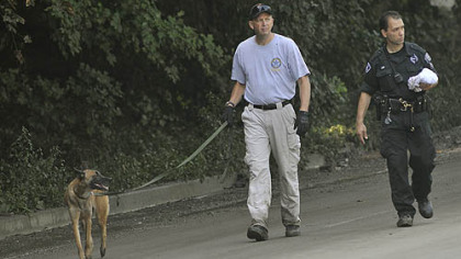 K-9 units assisted in the search for a woman who was swept away in the flood Friday. Her body was recovered today.