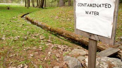Members of the Sykesville Hunting Club in Clearfield County posted this sign near the natural spring on their hunting camp property in Moshannon State Forest. The spring was contaminated by leaks from Marcellus Shale drilling operations.