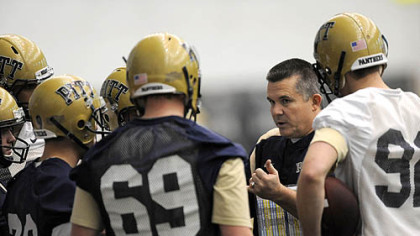 New Pitt head coach Todd Graham talks with a group of players during the first day of spring practice at the UPMC Sports Performance Complex on the South Side.