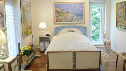 The master bedroom, decorated with Mr. Koerner's art and hand painted furniture.