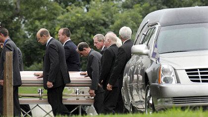 A casket is taken into Murrysville Community Church for the funeral for Kimberly, Brenna and Mikaela Griffith, who died in Friday's flash flood along Washington Boulevard.