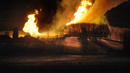 Flames leap into the air Thursday night at Hanover Farms in Hanoverton, Ohio. Officials believe a natural gas pipeline exploded.
