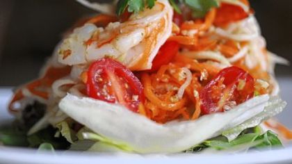 The menu at Kanok Thai restaurant includes the papaya salad with green papayas, carrots, grape tomatoes and shrimp.