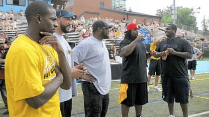 Emmanuel Sanders, Charlie Batch, coach Mike Tomlin, Willie Colon and Tria Essex were on hand at Ben Roethlisberger's youth football camp Monday at Seneca Valley.