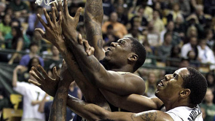South Florida forward Ron Anderson Jr., fouls Pitt's Dante Taylor while crashing into Pitt's Nasir Robinson during the first half of Wednesday's game in Tampa, Fla.