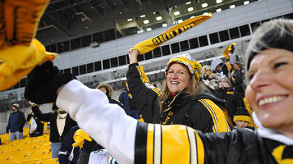 Sandy Gobrish, left, of Ross and BJ Vucelich cheer on the Steelers during a rally for fans.