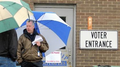 Ron Pasic has won the nomination to the West Allegheny school board on both tickets in unofficial results. Here, he waits to greet voters outside the North Fayette municipal building.
