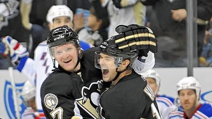 Chris Kunitz celebrates his short-handed goal against the New York Rangers in the third period Sunday at Consol Energy Center.