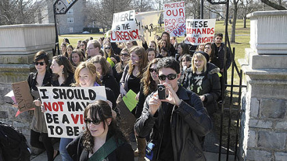 Students at Dickinson College in Carlisle, Pa., march across the campus Wednesday demanding the school deal more harshly with students who commit sexual offenses.