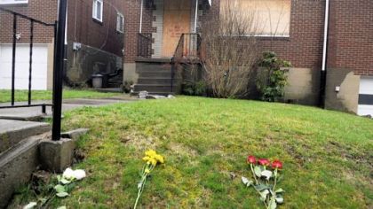 Flowers are placed in front of the boarded-up Stanton Heights home of Richard Poplawski to mark the second anniversary of the deaths of Officers Paul J. Sciullo II, Stephen J. Mayhle and Eric G. Kelly. The officers were were killed outside the house on April 4, 2009.