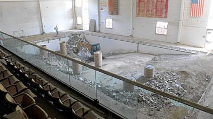 Moon Area High School is being converted into a middle school. Construction workers work on the pool area.